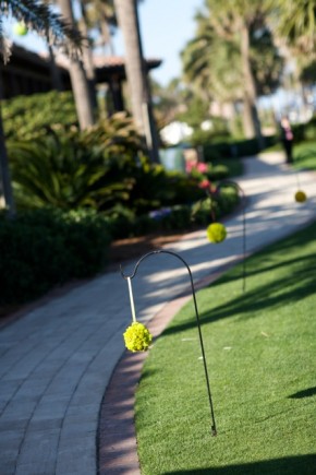 Green wedding flowers on walkway