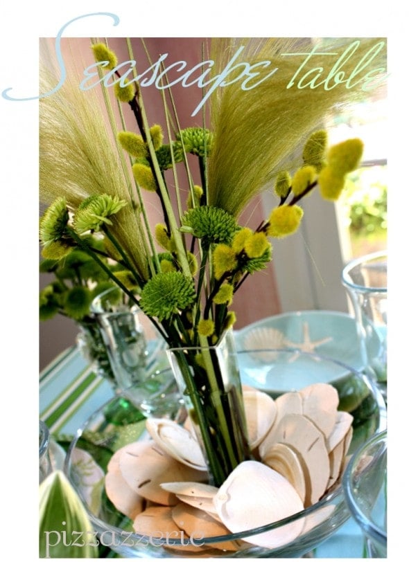 blue and green seaside table setting with seashells