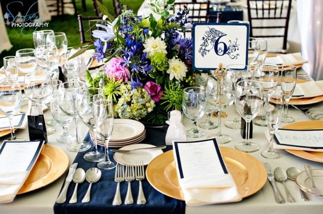 blue and gold wedding reception table setting picture